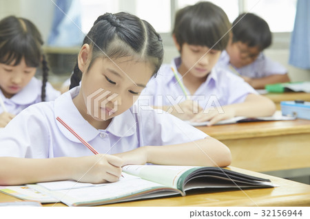Students are learning and writing in the classroom Students are learning and writing in the classroom 32156944