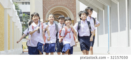A group of students is running and smiling because of excitement 32157030