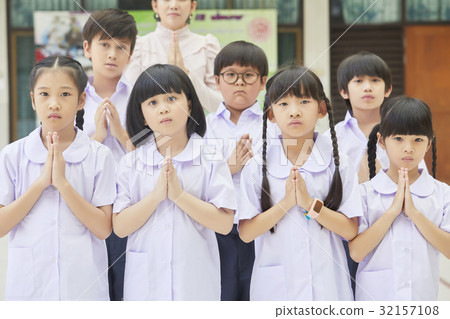 a photo of pupils clasping their hands and looking at something. a photo of pupils clasping their hands and looking at something. 32157108