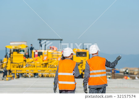 two engineers at airport runway two engineers at airport runway 32157574