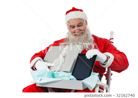 Santa claus removing digital tablet from gift box 32162740