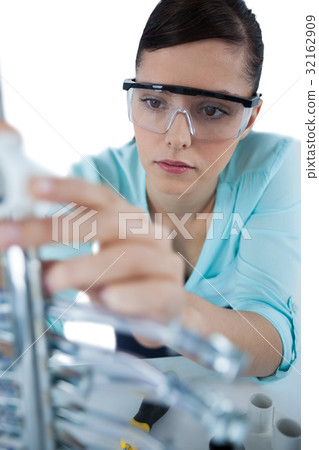 Female computer engineer repairing computer motherboard 32162909