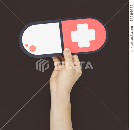 Human Hand Holding Medication Cross Human Hand Holding Medication Cross 32164671
