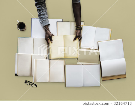 Hand with a empty book collection 32164713
