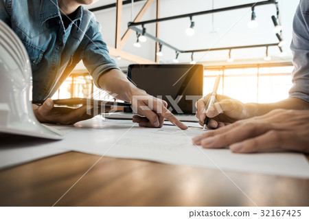 Two Architects engineer discussing data working and tablet, lap Two Architects engineer discussing data working and tablet, lap 32167425