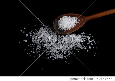 Wooden spoon in sea salt. Sea salt close up 32167662