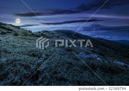 grassy hillside of mountain in summer at night grassy hillside of mountain in summer at night 32169784
