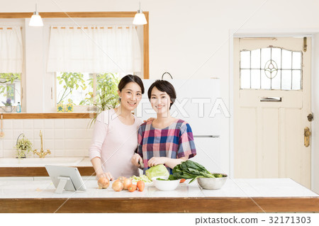 Mother and girl cooking Mother and girl cooking 32171303