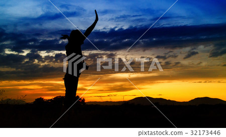 silhouette of woman and beautiful twilight with sunset silhouette of woman and beautiful twilight with sunset 32173446