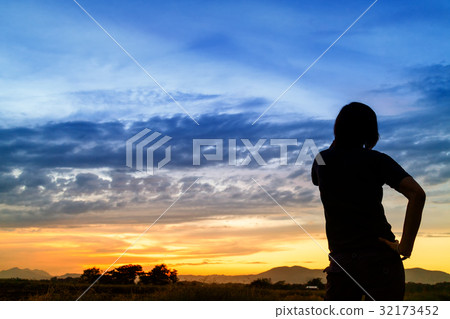 silhouette of woman and beautiful twilight with sunset silhouette of woman and beautiful twilight with sunset 32173452