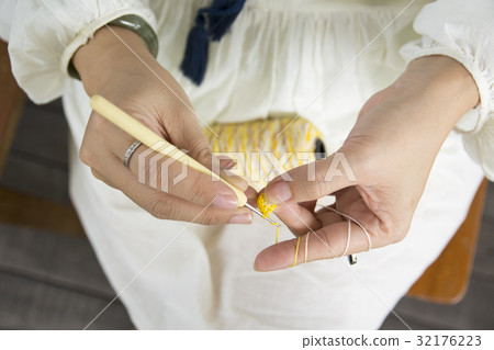 Close-up of hands knitting. Close-up of hands knitting. 32176223