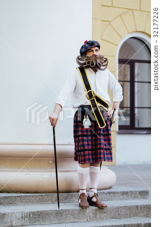 Handsome portrait of a brave Scot with a amazing Handsome portrait of a brave Scot with a amazing 32177226