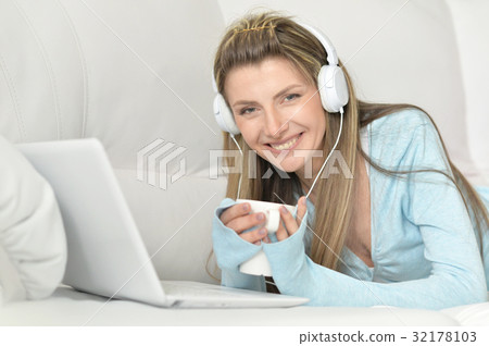 Beautiful young woman with modern laptop Beautiful young woman with modern laptop 32178103