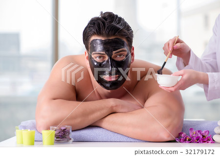 Handsome man in spa massage concept Handsome man in spa massage concept 32179172