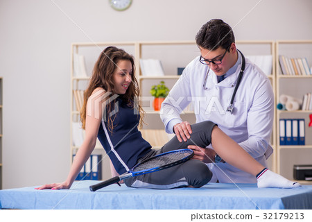 Man doctor taking care of sports injury Man doctor taking care of sports injury 32179213