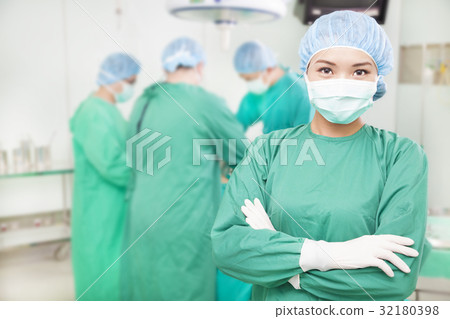 female surgeons  crossed hands with  teams 32180398