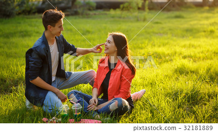Loving couple of teenagers. Picnic Loving couple of teenagers. Picnic 32181889