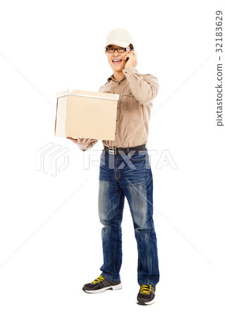 delivery man talking phone and holding parcel delivery man talking phone and holding parcel 32183629