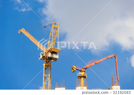 tower crane and concrete pump at construction site 32192083