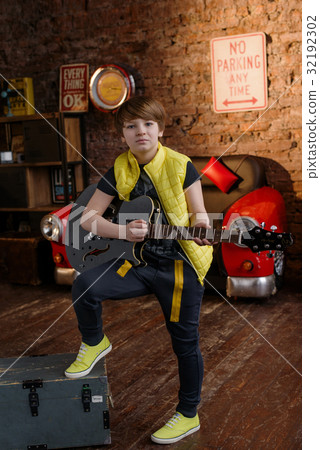 Boy in loft music studio 32192302