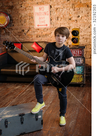 Boy in loft music studio 32192303