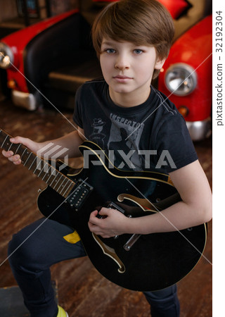 Boy in loft music studio Boy in loft music studio 32192304