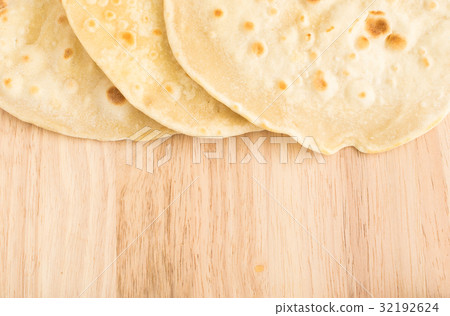 Flat Bread on a Wooden Background Flat Bread on a Wooden Background 32192624