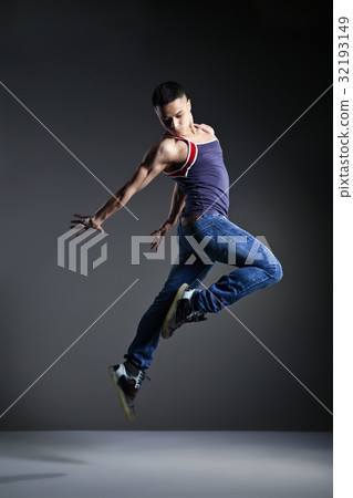 Dancer posing in front of the studio background Dancer posing in front of the studio background 32193149