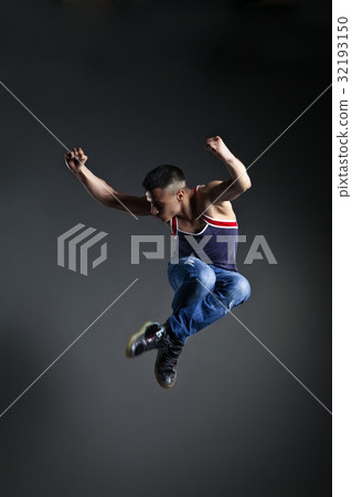 Dancer posing in front of the studio background Dancer posing in front of the studio background 32193150