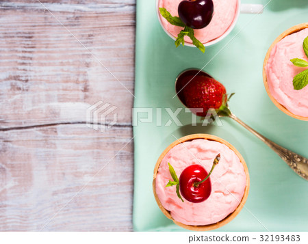 Home made strawberry ice cream served in cones 32193483