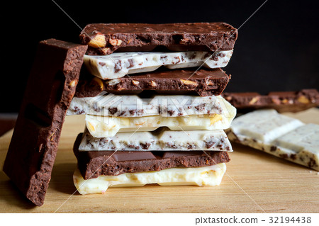 chocolate bar stack on wooden background. chocolate bar stack on wooden background. 32194438