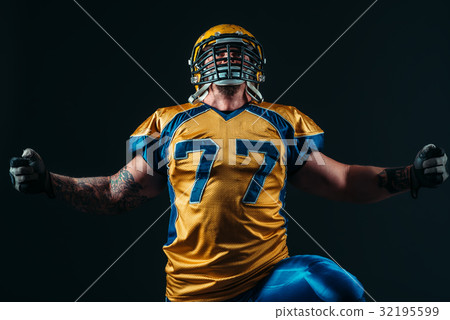 American football player in uniform and helmet 32195599