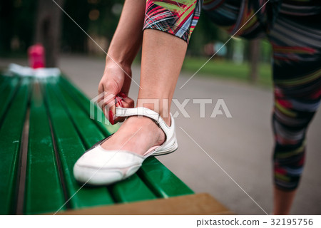 Sporty female person buttons footwear Sporty female person buttons footwear 32195756