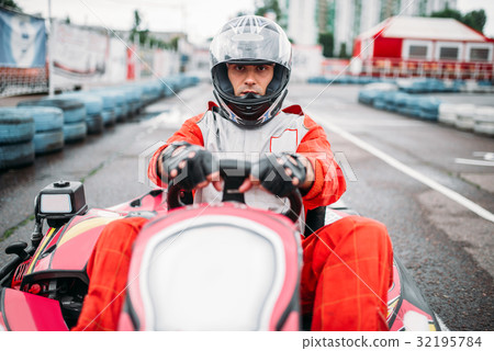 Karting race, go cart driver in helmet 32195784