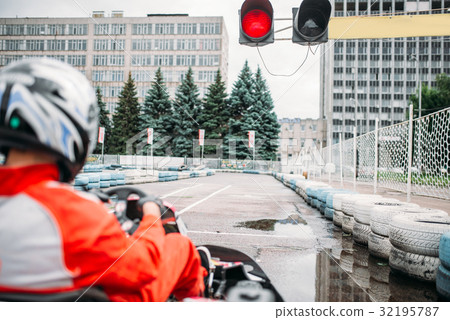 Go kart driver on start line, back view 32195787
