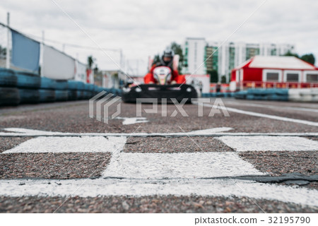Karting racer on finish line, go kart competition 32195790