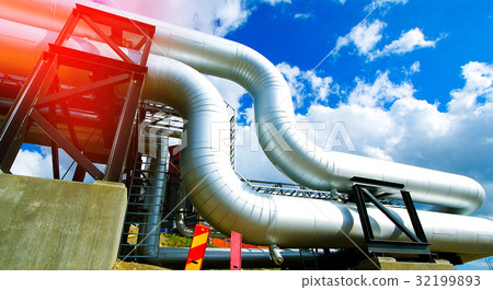 Steel pipelines and valves against blue sky 32199893