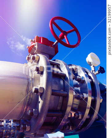 Steel pipelines and valves against blue sky Steel pipelines and valves against blue sky 32199957