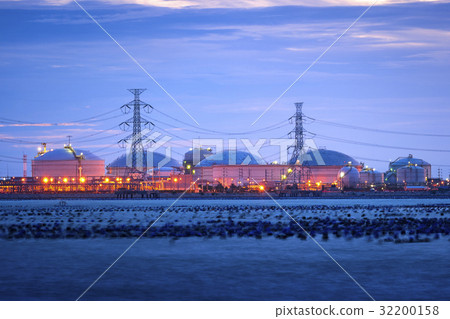 Electric tower with petrochemical in background 32200158