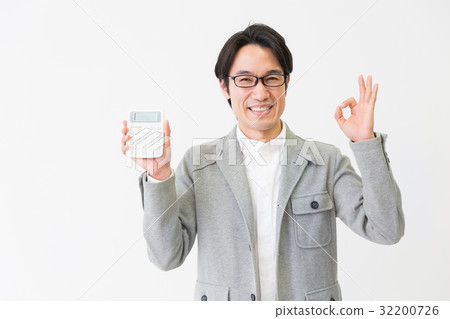 A man with a calculator 32200726