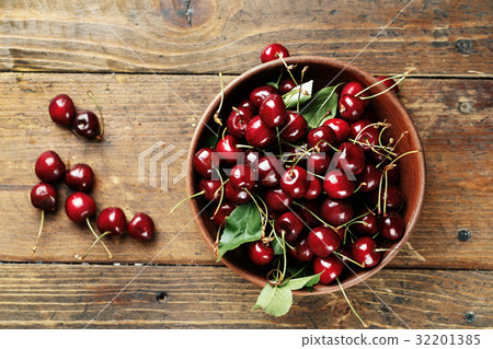 Ripe cherries on a wooden background Ripe cherries on a wooden background 32201385