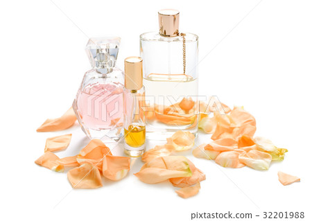 Perfume bottles with flower petals on light Perfume bottles with flower petals on light 32201988
