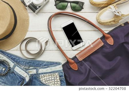 Top view accessoires to travel with women clothing 32204708