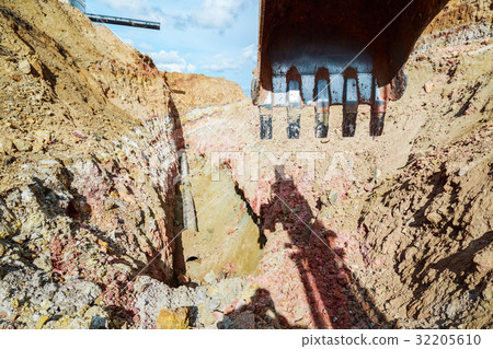 Excavator digging a trench for the pipeline.  32205610