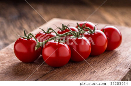 Cocktail tomatoes on wooden board. cherry tomatoes 32205934