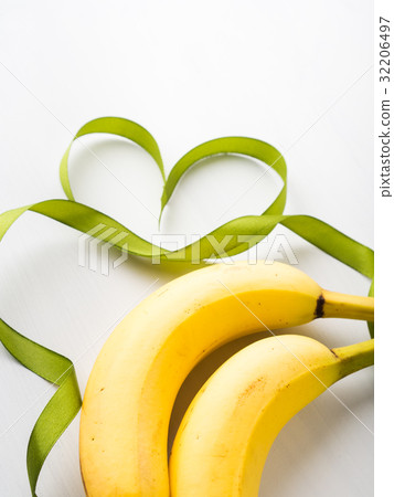 Two bananas with green ribbon frame 32206497