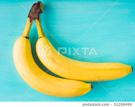 Two bananas on green pastel Two bananas on green pastel 32206499