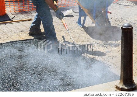 Construction workers during asphalting road Construction workers during asphalting road 32207399