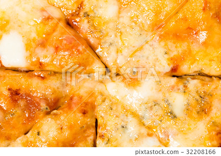 Closeup of melted cheese on sliced pizza. Closeup of melted cheese on sliced pizza. 32208166