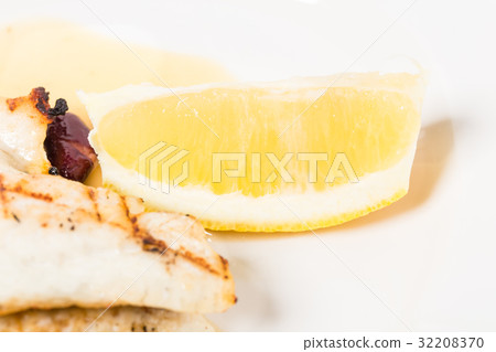 Delicious baked dorado fillet with lemon. Delicious baked dorado fillet with lemon. 32208370